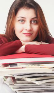 young beautiful woman is looking over work files